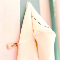 Hanging baby hooded towel with Nori in Story brand tag